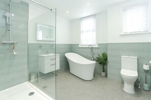 Bathtub, hair dryer, towels, soap