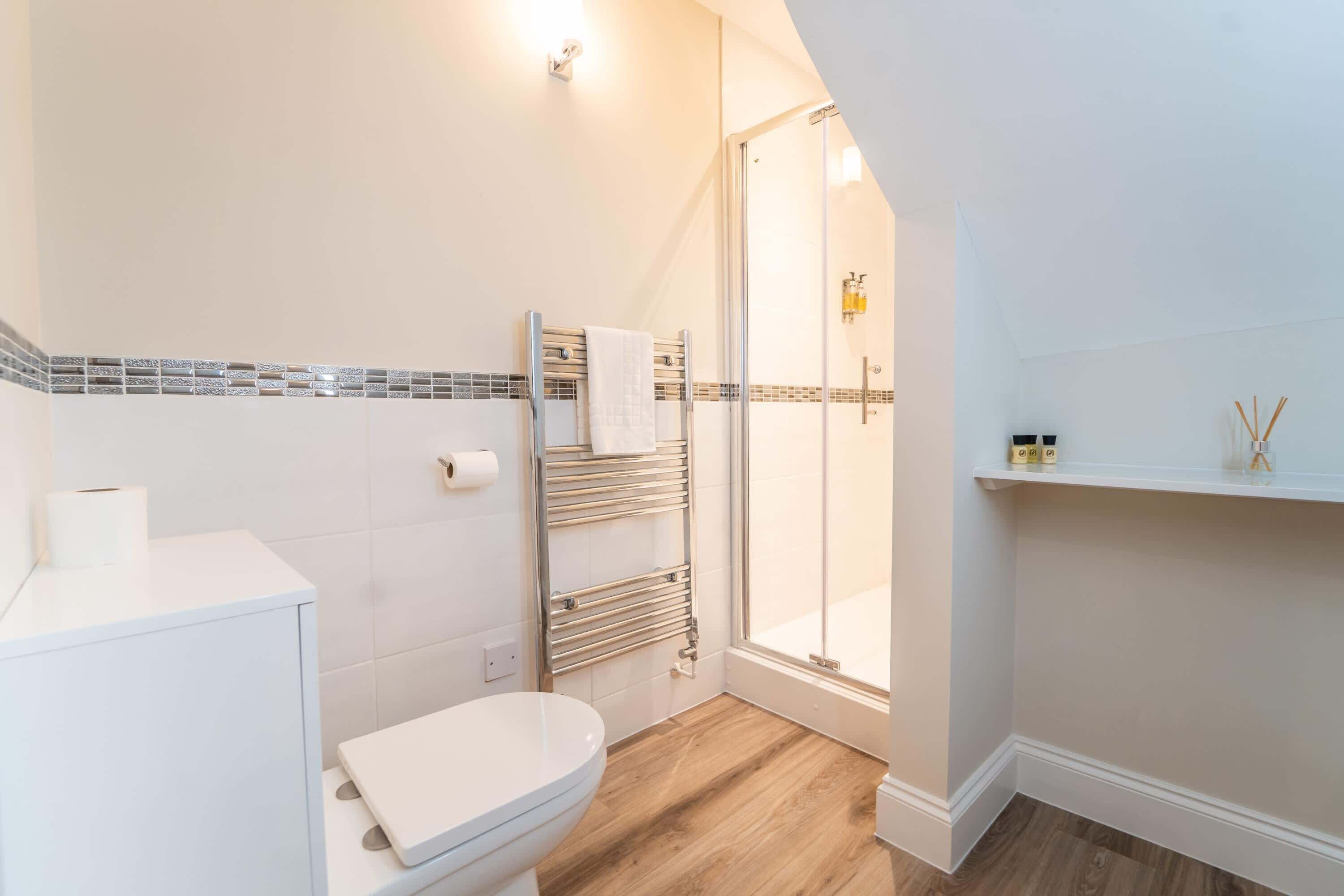 Shower, hair dryer, towels, shampoo