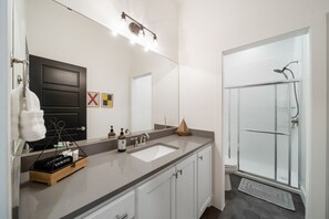 Shower, hair dryer, towels, soap