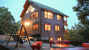 A log cabin with a balcony, outdoor seating, and a fire pit. - MTN views! PoolTable, AirHockey, Foosball, HotTub, FirePit; Perfect for FAMILIES (Sevierville)
