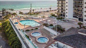 A hotel with a pool area, a beach view, and a parking lot. - Coastal Bliss and Million Dollar Views (Miramar Beach)