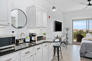 Enjoy a meal in the dining area with a view of the outdoors.