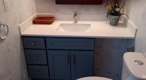 Bathtub, hair dryer, towels, soap