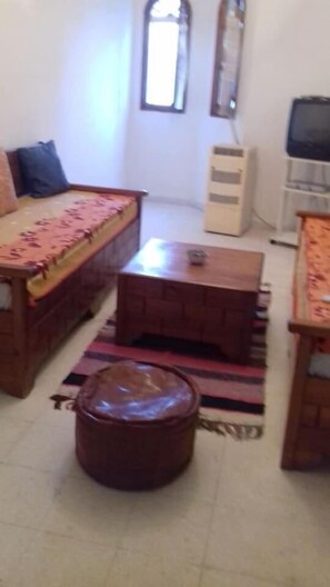 Room, 2 Bedrooms, Balcony, Garden View | Living area | TV