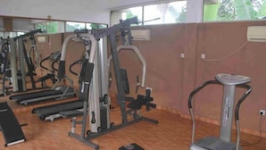 A gym with treadmills, weight machines, and a stationary bike. - Room-the Golf Prince Hotel-guest Room (Port Harcourt)