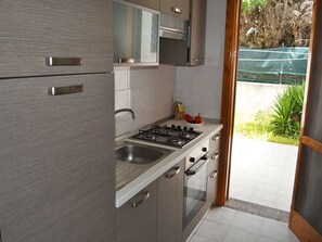 House, 2 Bedrooms, Smoking, Patio | Private kitchen | Fridge, cookware/dishes/utensils - Holiday Home With Equipped Outdoor Area in Torre Dell'orso (Melendugno)