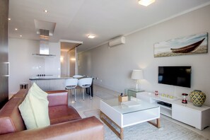 Appartement, 1 chambre, patio, vue sur l’océan | Aire de séjour