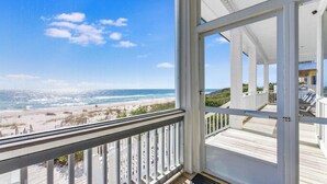 A balcony with a view of the beach and ocean. - CJ's Beach Front 6 BR Heated Pool Private Home (St. George Island)