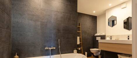 Bathtub, hair dryer, towels, soap