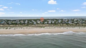 A coastal residential area with houses along the beach and ocean view. - OCEANFRONT- Hatteras Island/Salvo: 2 Primaries, Hot Tub, Large Open Living Space (Salvo)