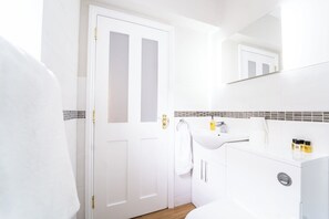 Shower, hair dryer, towels, shampoo