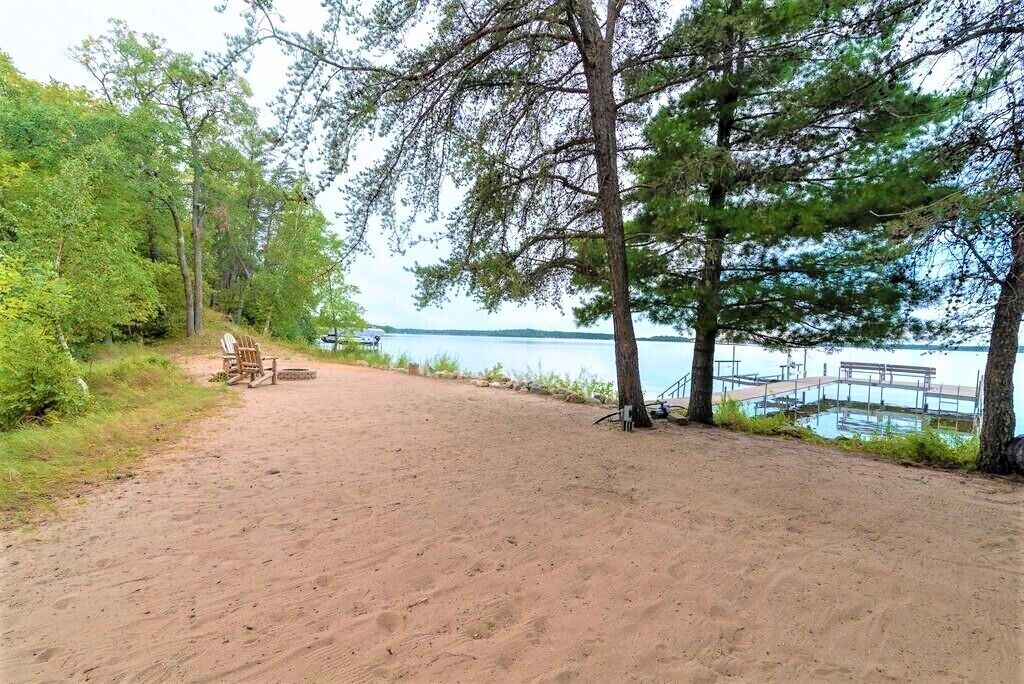 Magnificent 5 bedroom retreat home with beautiful sand beach on Whitefish Lake