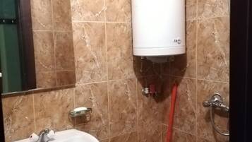 Shower, towels, soap, toilet paper