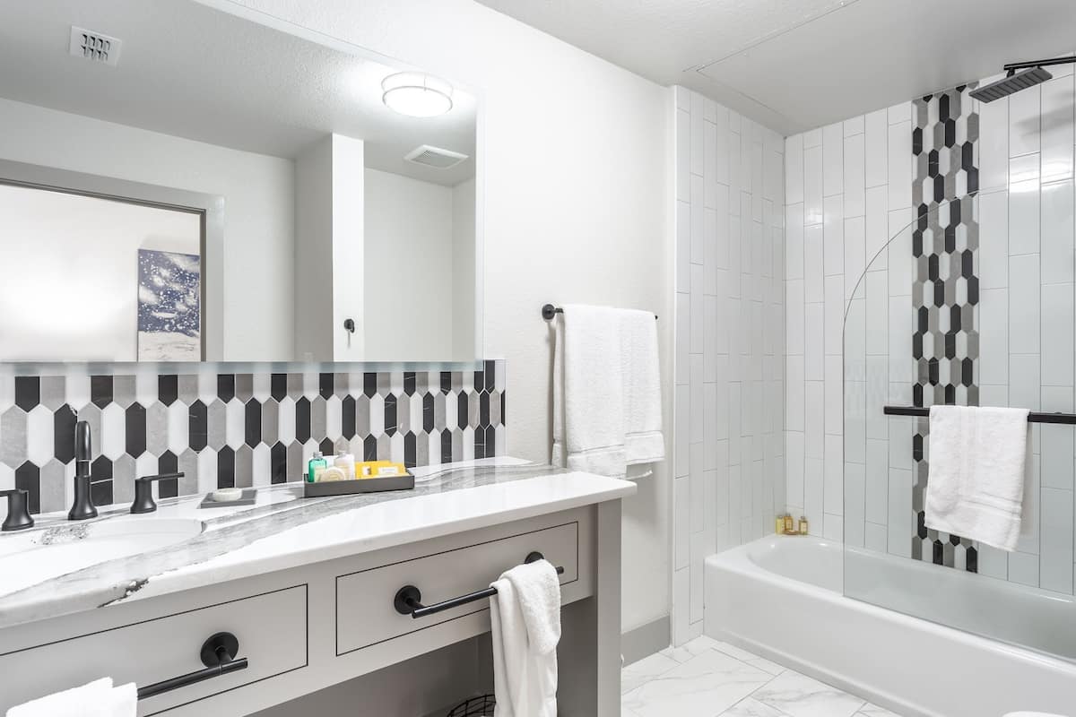 design room | bathroom | combined shower/bathtub, rainfall showerhead, designer toiletries