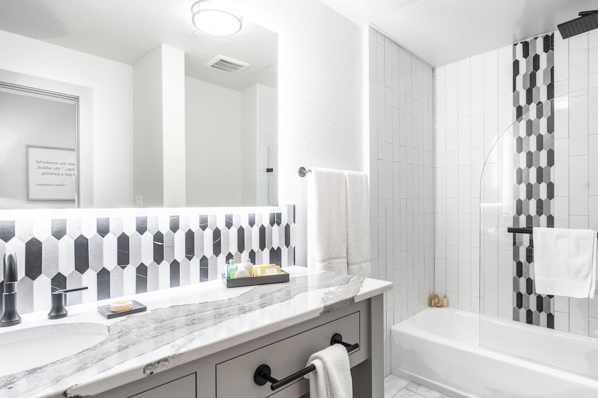 combined shower/bathtub, rainfall showerhead, designer toiletries