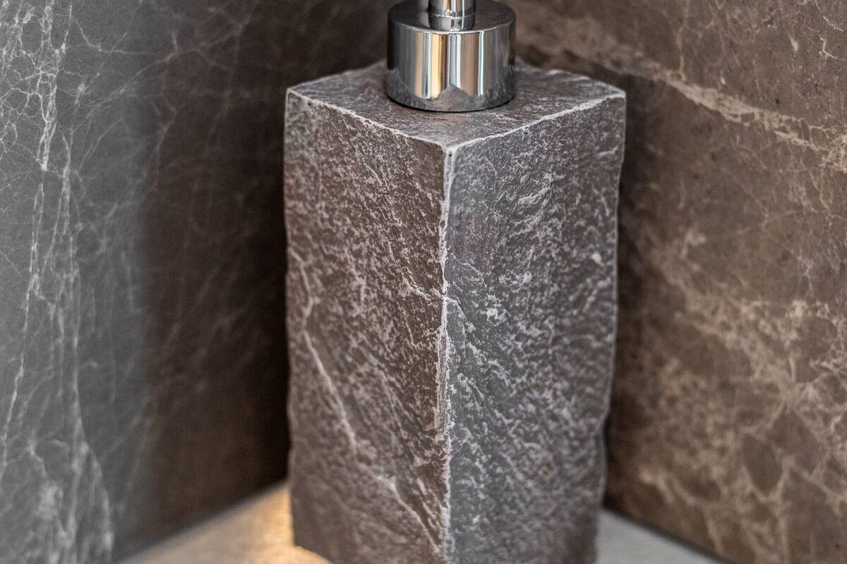 designer toiletries, hair dryer, bathrobes, slippers