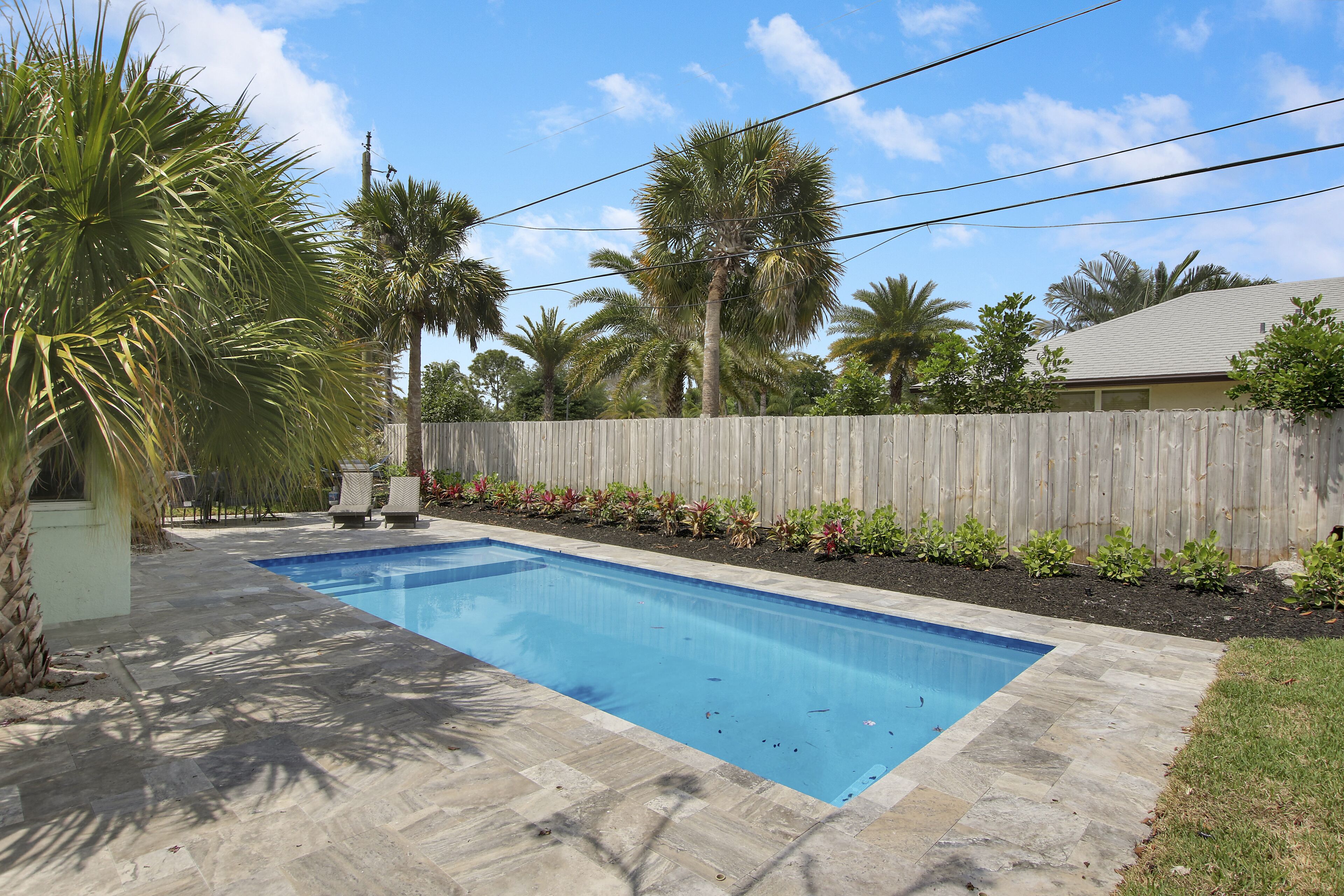 Coastal house in Juno beach with heated saltwater pool. Walk to the local beach.