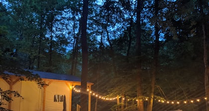 Custom design Safari Tent overlooking a serene running creek & natural waterfall