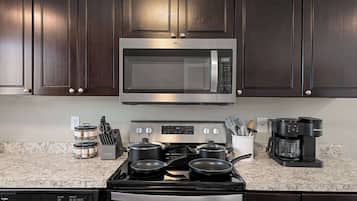 Coffee/tea maker, fridge, microwave, oven