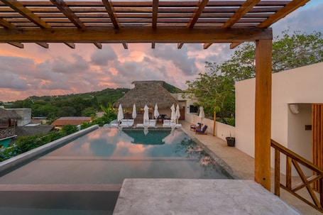 Outdoor pool, open 9:00 AM to 9:00 PM, free cabanas, sun loungers