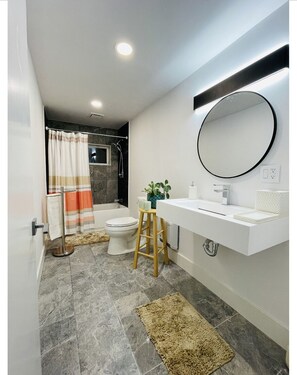 Combined shower/bathtub, hair dryer, towels, soap - Mid-Century modern Lakeview Stay (Ithaca)
