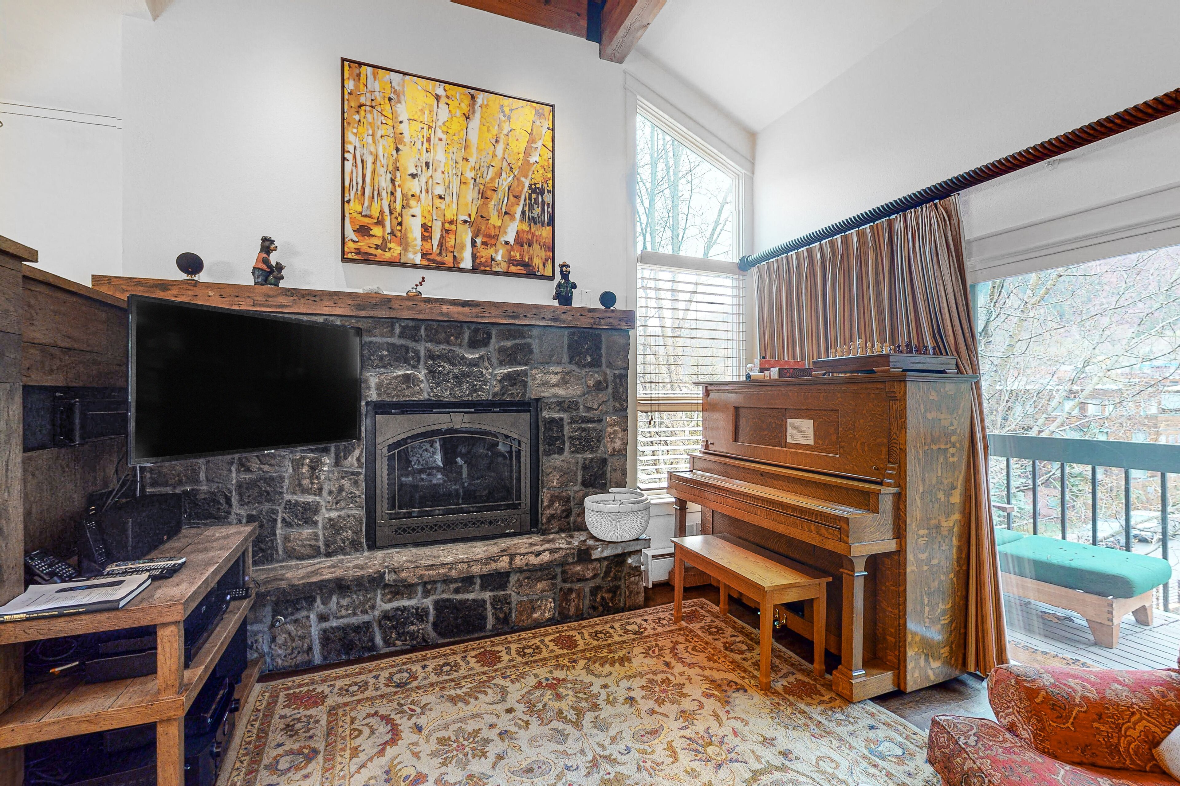 River- & mountain-view condo with fireplace - walk to lifts & Town Park