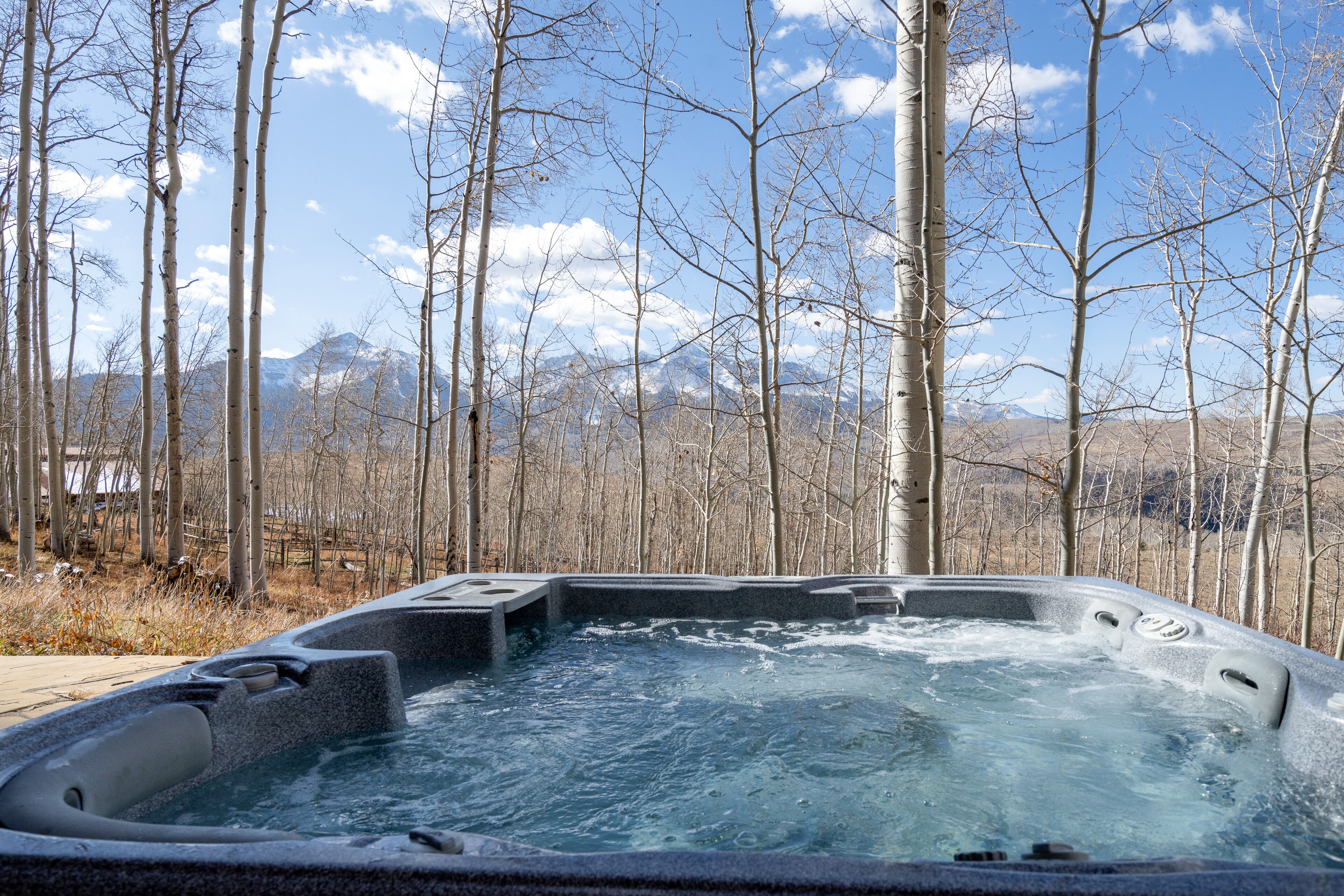 Luxury home with majestic mountain views, private hot tub, fireplace & deck