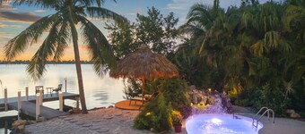 Key West Beach House with heated pool, tiki, and dock.♿︎