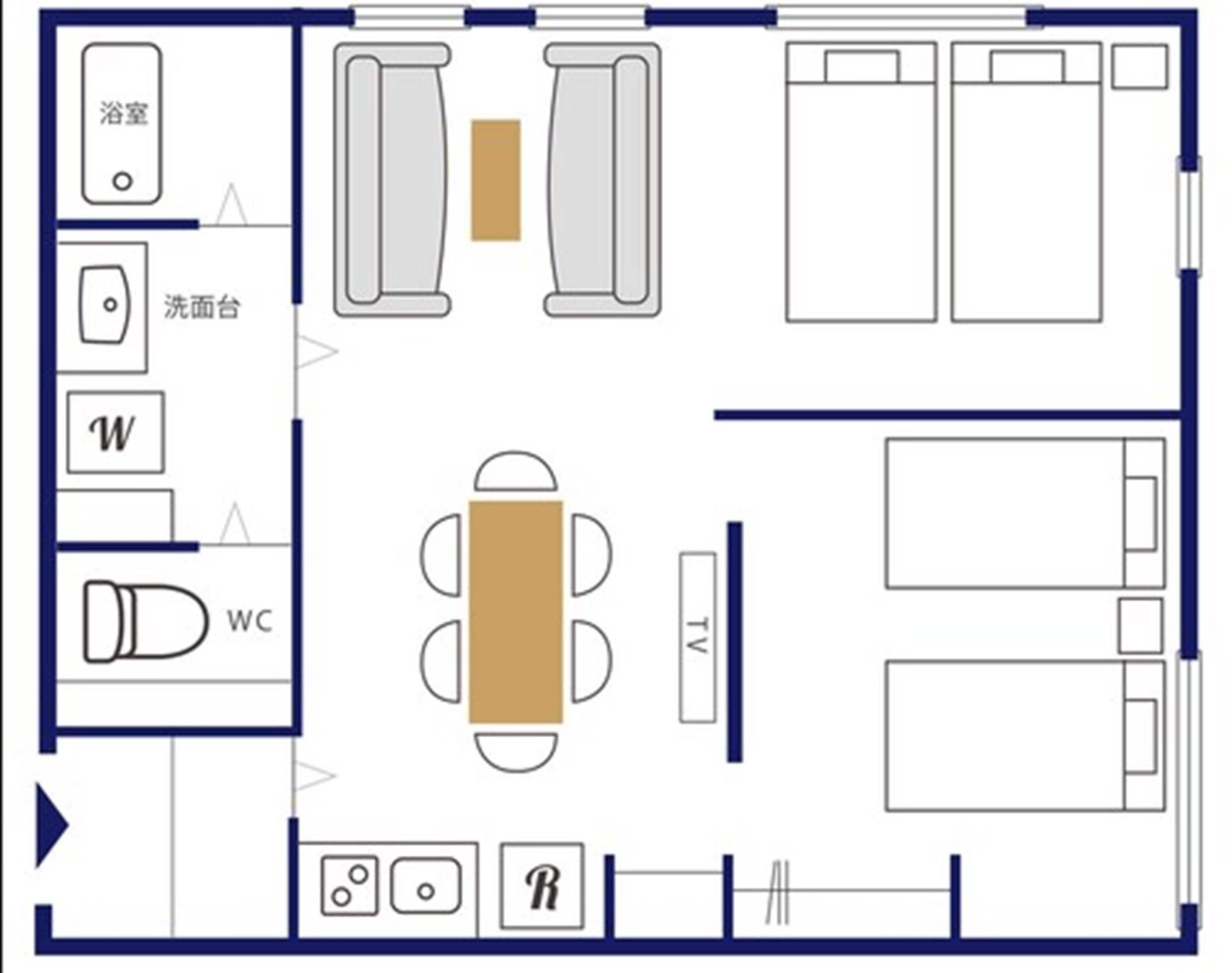 Distribución de una habitación de hotel con baño, inodoro, una pequeña zona de estar y cama.