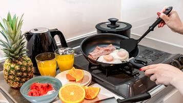 Full-sized fridge, microwave, stovetop, electric kettle