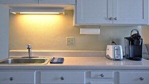 A kitchen with a sink, a toaster, a kettle, and a paper towel holder. - Entire apartment, close to Hershey  (Palmyra)