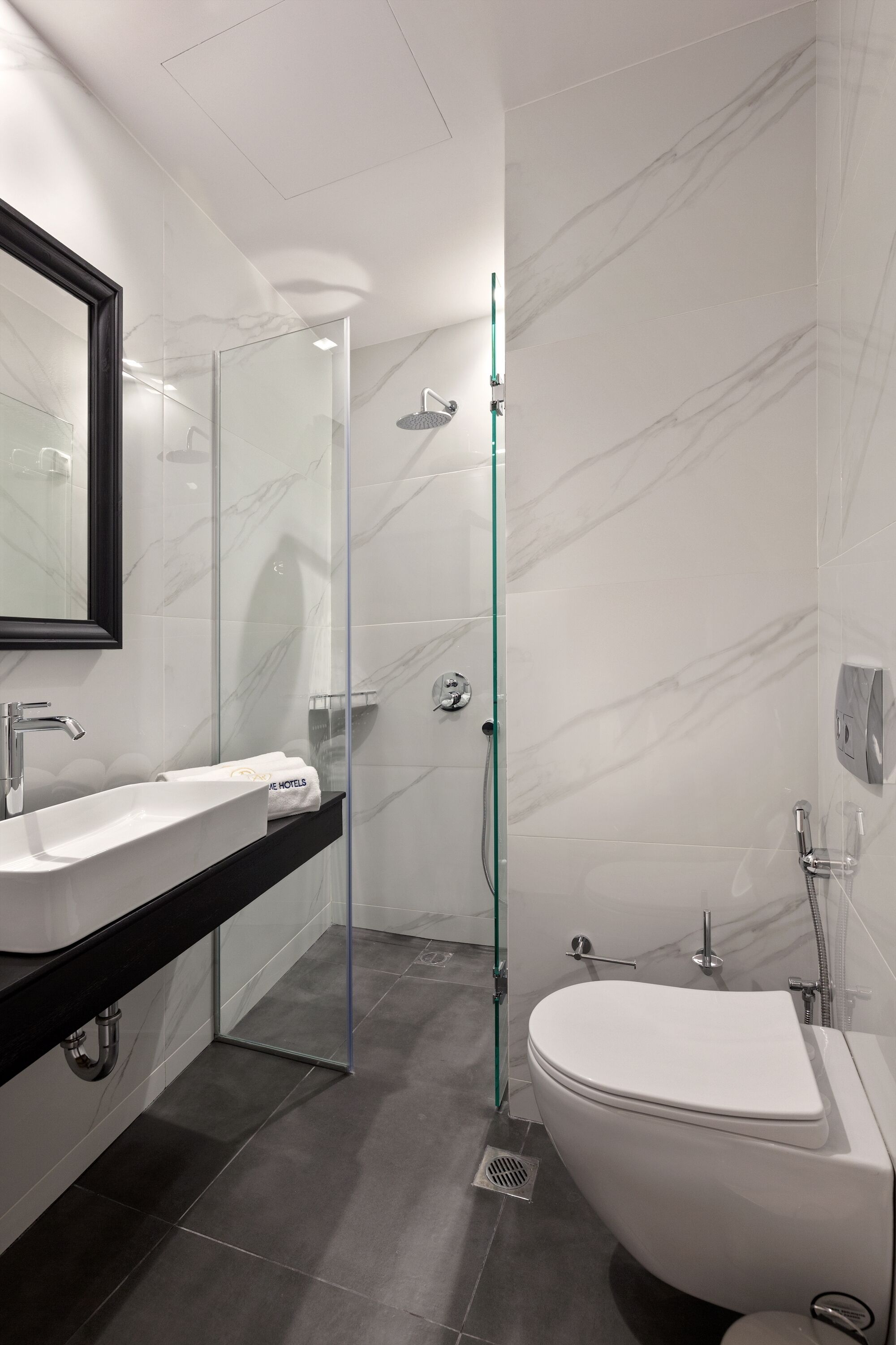 classic double or twin room | bathroom | rainfall showerhead, free toiletries, hair dryer, bidet