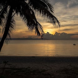 On the beach, white sand, sun-loungers, beach umbrellas