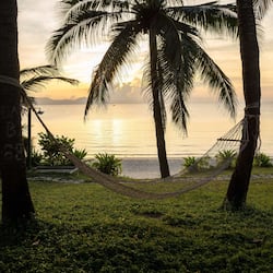 On the beach, white sand, sun-loungers, beach umbrellas