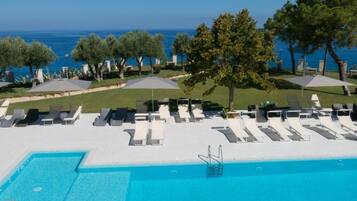 Outdoor pool, open 10:00 AM to 6:00 PM, pool umbrellas, sun loungers