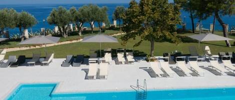 Outdoor pool, open 10:00 AM to 6:00 PM, pool umbrellas, sun loungers