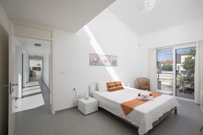 A bedroom with a bed, a nightstand, a chair, and a window with a view. - Villa Elsa with 4 bedrooms (Krnica)