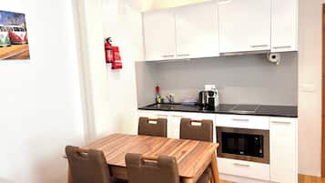 Economy Quadruple Room, Courtyard View | Private kitchen | Coffee/tea maker