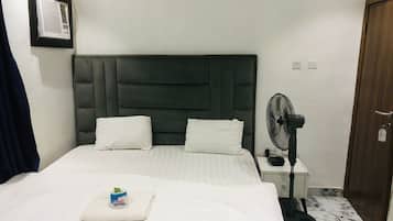 Premium bedding, desk, laptop workspace, soundproofing