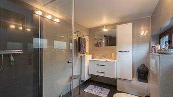 Bathtub, hair dryer, towels, soap