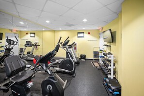 A gym with stationary bikes, treadmills, and weight machines. - Stunning 3BR Gulf-View Condo Ground-Floor (Gulf Shores)
