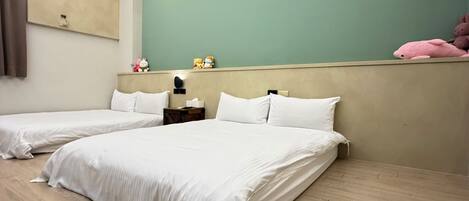 A hotel room with two beds, a ceiling fan, an air conditioning unit, a nightstand, and a green wall.