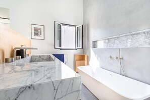 Shower, eco-friendly toiletries, hair dryer, towels