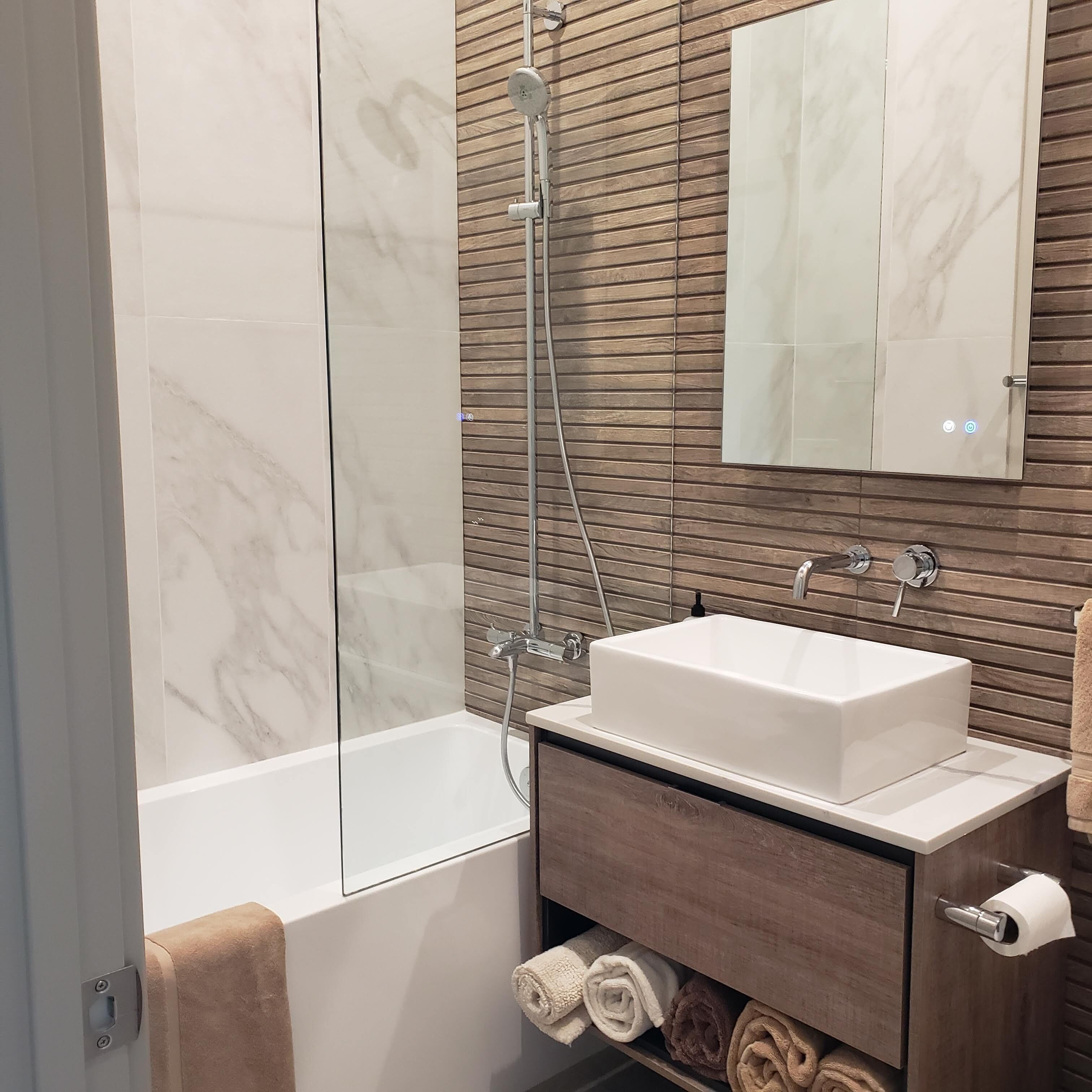 Combined shower/tub, hair dryer, towels, soap