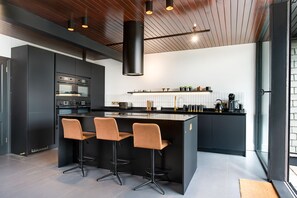 Dishwasher, dining tables, kitchen islands