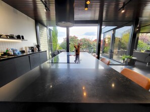 Dishwasher, dining tables, kitchen islands