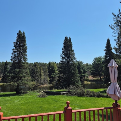 SECLUDED WOODLAND ESCAPE NEAR WISCONSIN DELLS WITH POND ON 80 PRIVATE ACRES