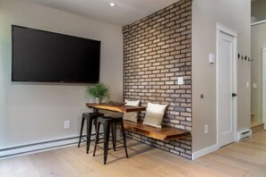 Relax in this stylish space with a flat-screen TV and a cozy seating area.