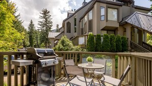 A deck with a grill, chairs, and a table. - Prime Central Location | 5BR | Walk to Village/Lifts | Free Parking | Managed by Aloha Whistler (Whistler)