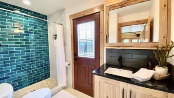 Shower, hair dryer, towels, soap